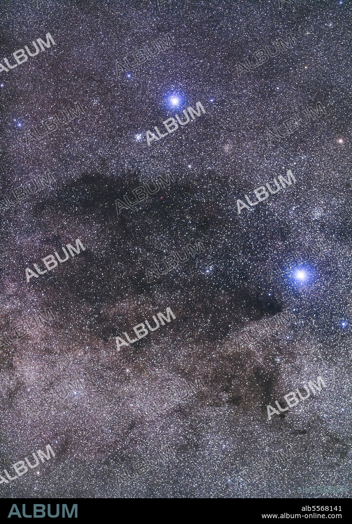 The Coal Sack dark nebula next to the Southern Cross framed with a 200mm telephoto lens. The scene includes the open star cluster, the Jewel Box (NGC 4755) at left of Beta Crucis (aka Becrux) at left, and the dimmer star clusters NGC 4609 (left of Acrux at bottom), Trumpler 20 (right of Becrux) and NGC 4349 (above Acrux).