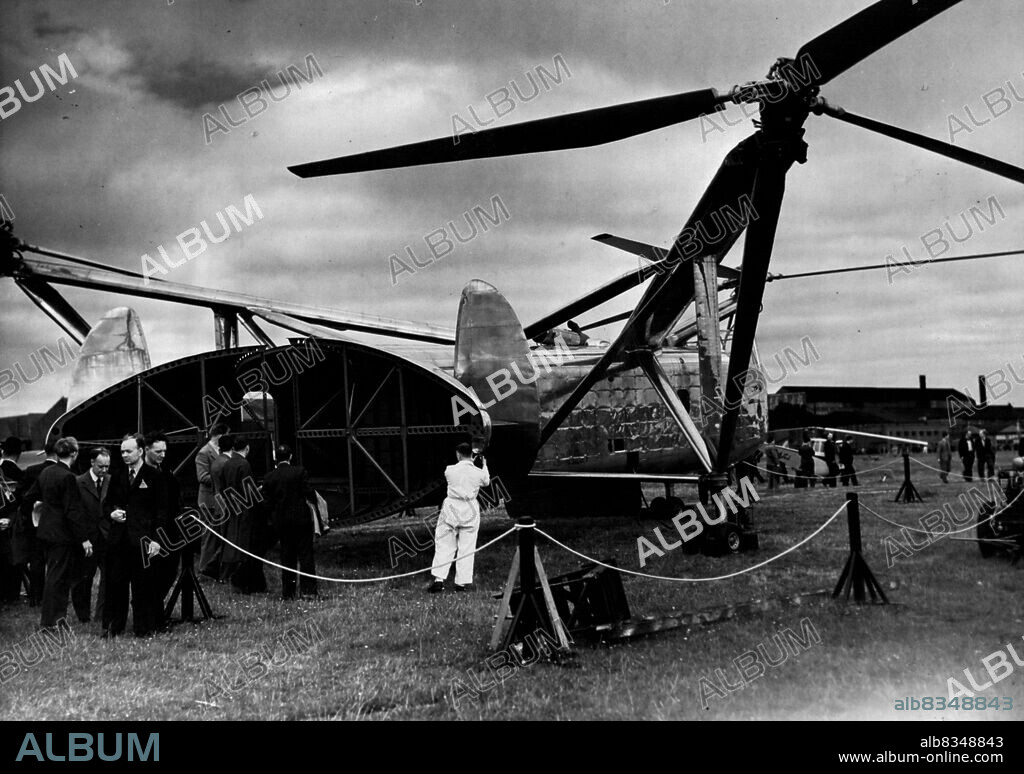 British Aircraft On Show To The World -- The Cierva Helicopter W-11 "Air Horse", with tail opened, at the exhibition. It carries 24 passengers. The annual exhibition of the Society of British Aircraft Constructors, which opened yesterday at Farnborough, Hampshire, introduced some of the latest British aircraft to the public and the world. September 8, 1948. (Photo by Fox Photos).