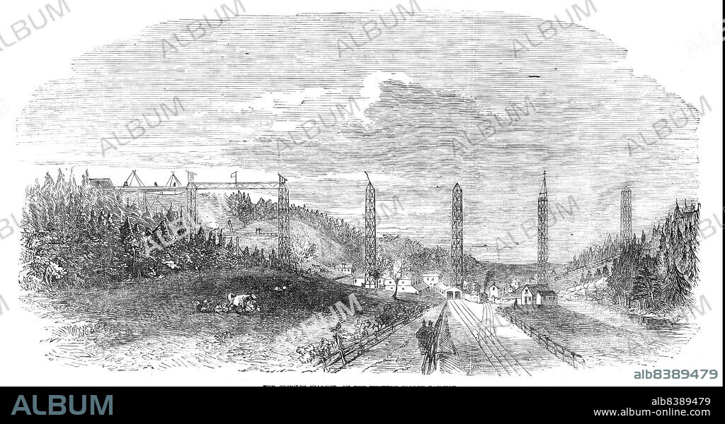 The Crumlin Viaduct, on the Western Valley Railway [in South Wales], 1854. '...each of the iron piers which are to support the girders...is, within 12 ft., the height of the London Monument...each of the girders...is 150 feet long...the Taff Vale Extension Railway...will contribute materially to develop the mineral wealth of South Wales...on the right hand is a smaller Viaduct of two piers stretching across the Kenydon-road; and a Tramway, belonging to Sir B. Hall, Bart., M.P. The principle of the girder is stated to be patented by Captain Warren and the contractor of the Viaduct, Mr. T. W. Kennard...When the girder was "planted," a loud and hearty cheer burst from the lips of the workmen...while one, more courageous than the rest, actually walked across the girder, which was about a foot in width, and 200 feet from the ground'. From "Illustrated London News", 1854.
