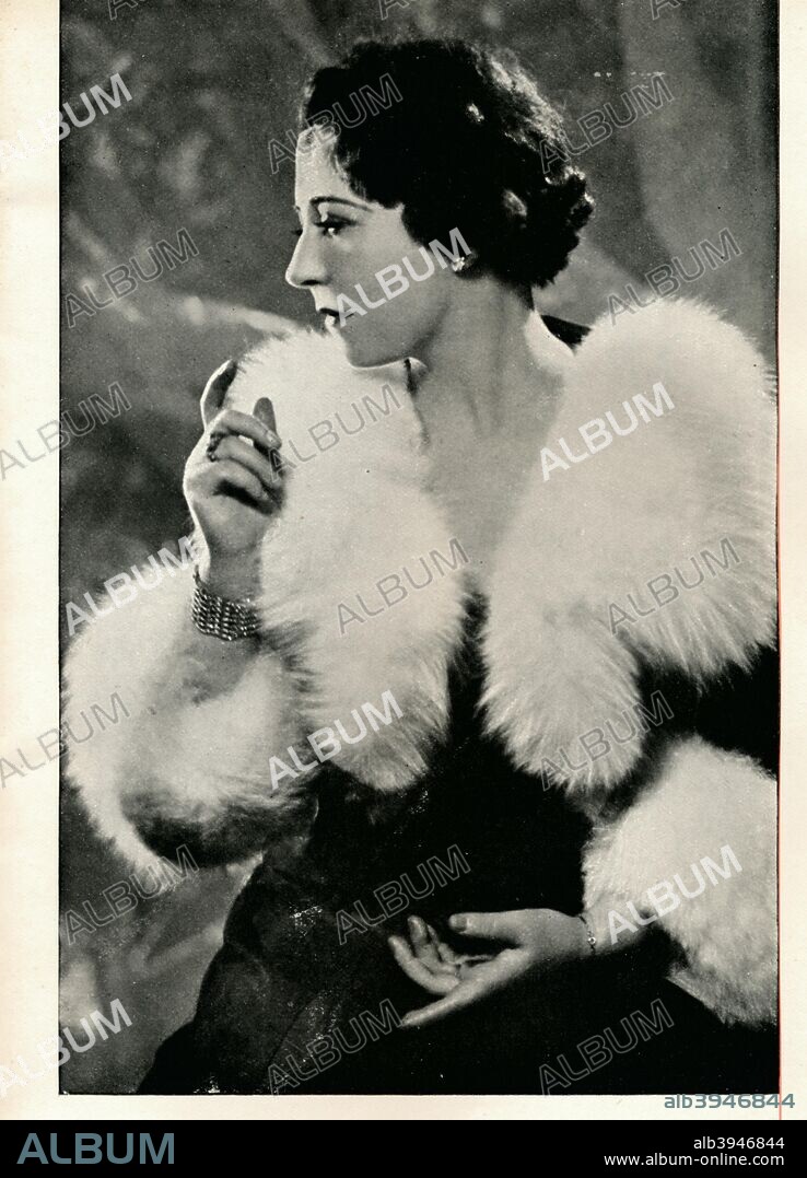 'Your call, Miss Arnaud A Cocktail With Booth's? - Ah Yes! Without Booth's?' Arnaud.', c1935 (1935). Yvonne Arnaud (1890-1958), French pianist, singer and actress. From An Anthology Of Cocktails Together With Selected Observations. [Dorland Advertising Ltd., c1935].
