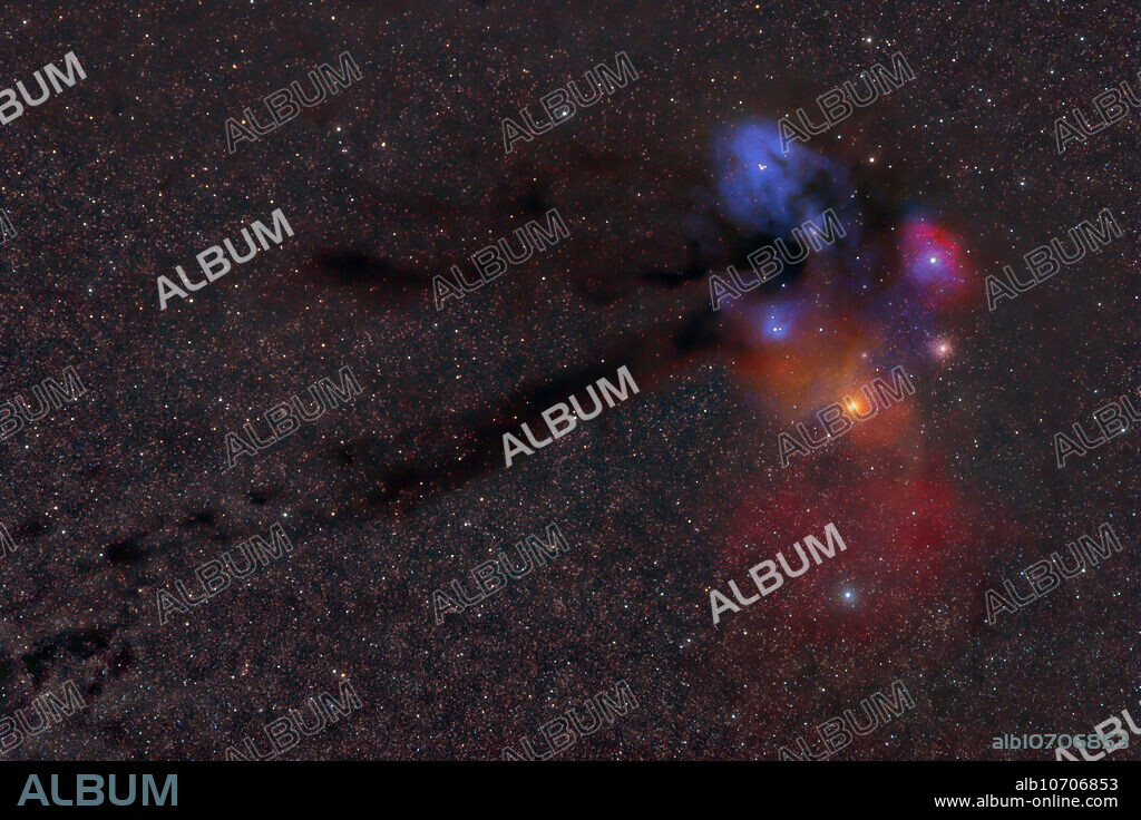 Barnard 44, the Dark River, in the center of this image, is a large dark nebula in Ophiuchus that stretches 10 degrees from the Antares/Rho Ophiuchi nebulae complex to the east, all the way to the Pipe Nebula. It is 500 light-years away from us. Antares, a red supergiant star at the heart of Scorpius on the right side of the image, illuminates a rare yellow/red reflection nebula. Normally reflection nebulae are blue, like the one surrounding Rho Ophiuchi above Antares. Antares lies 600 light-years away and has a diameter of 400 times that of the Sun. Ancient globular cluster M4 can also be seen in the image, above and to the right of Antares. It lies at a distance of 7,200 light-years. E. E. Barnard listed the Dark River as Barnard 44 in his catalog of dark nebula in A Photographic Atlas of Selected Regions of the Milky Way, recording it on plate 13 and plate 14.