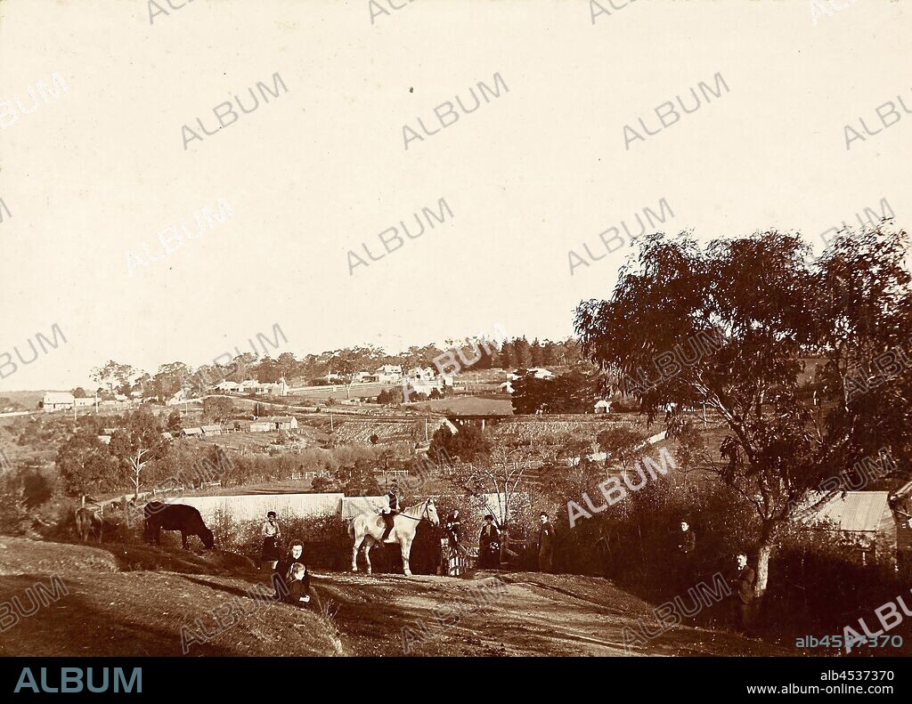 Digital Photograph - View from 'Willis Vale', Greensborough, Victoria, circa 1902, View looking south from the Partington family property 'Willis Vale' at Greensborough. The property was situated on a hill sloping down to the Plenty River. On a portion of the property was the orchard leased by Robert Whatmough for his nursery business. In the foreground are members of the Partington Family who lived in the main house. The orchard is directly behind them and follows the white.