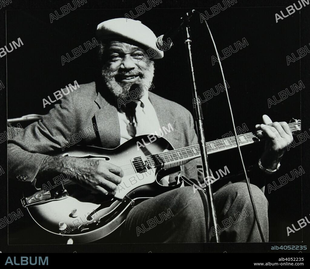 Slim Gaillard playing his guitar at the Forum Theatre, Hatfield, Hertfordshire, 13 November 1986.
