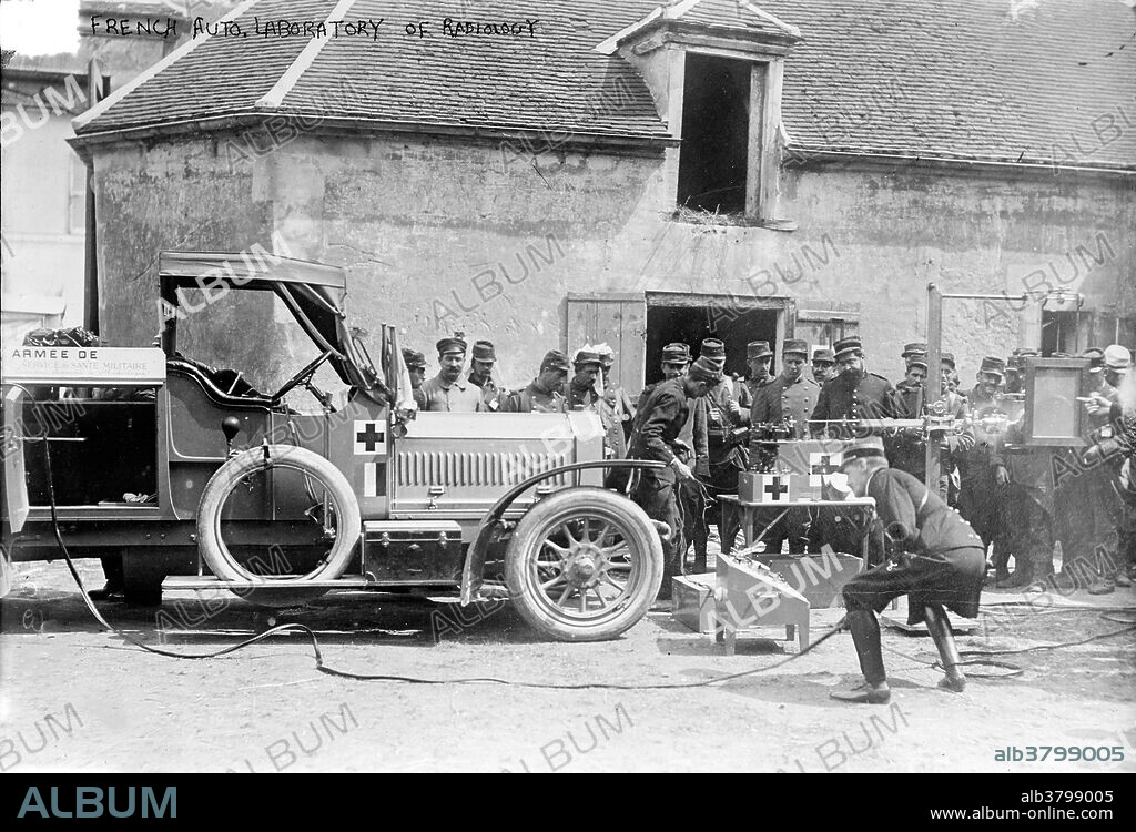 A mobile radiology automobile during World War I, probably in France. Mobile X-ray unit. French soldiers assembled around a mobile X-ray unit during World War I (1914-1918). X-rays had been discovered in 1895 by German physicist Wilhelm Conrad Roentgen, and soon became invaluable for medical diagnostics. When war broke out in 1914, Polish-French physicist Marie Curie worked with the French government to set up 20 mobile X-ray units (called 'petite Curies'). Such units saved the lives of many wounded soldiers. However, the X-ray operators, including Marie and her daughter Irene, were inadequately shielded from the effects of the radiation. Photograph from the Bain News Service, October 31, 1914.