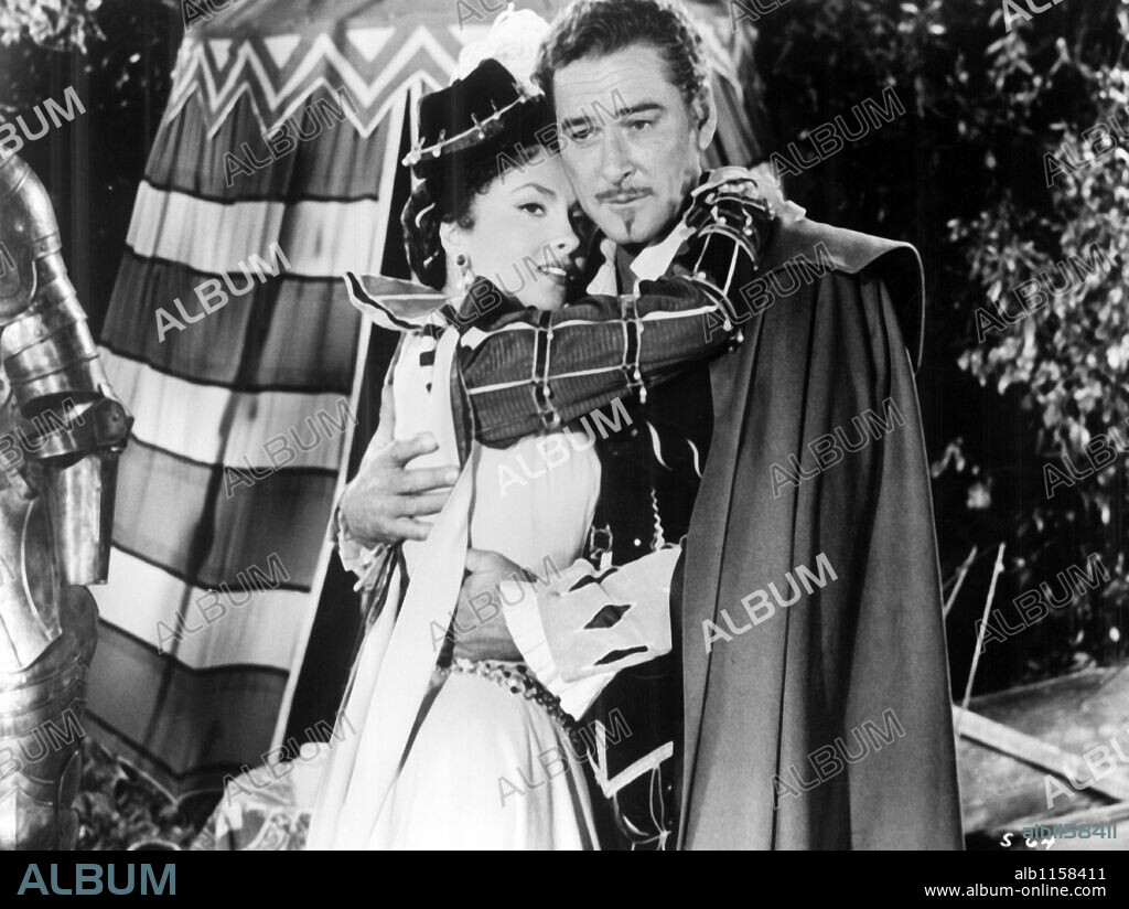 ERROL FLYNN and GINA LOLLOBRIGIDA in CROSSED SWORDS, 1954 (IL MAESTRO DI DON GIOVANNI), directed by MILTON KRIMS. Copyright ERROL FLYNN PRODUCTIONS/MAHON/VI-VA FILM.