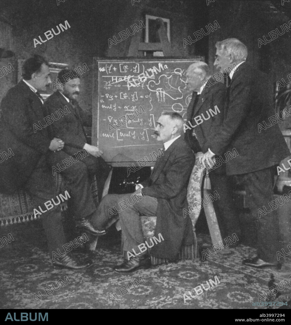 Albert Einstein and other physicists at Paul Ehrenfest's home, Leyden, Netherlands. Einstein (1879-1955) (left) with Paul Ehrenfest, Paul Langevin (1872-1946) (centre), Kamerlingh Onnes and Pierre Weiss.