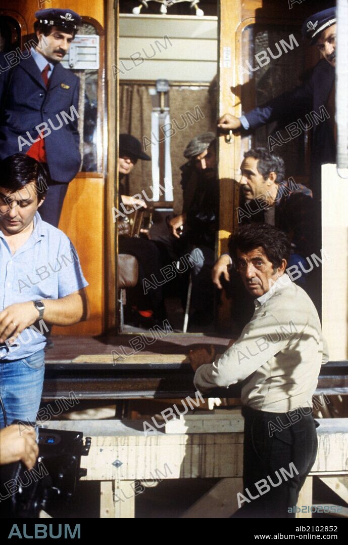 Silvio Spaccesi, Luigi Basagaluppi, Nanni Loy and Nino Manfredi on the set of Café Express. Italian actor Nino Manfredi, Italian director and actor Nanni Loy, Italian actor Luigi Basagaluppi and Italian actor and dubber Silvio Spaccesi having a rest on the set of the film Café Express. Italy, 1980.