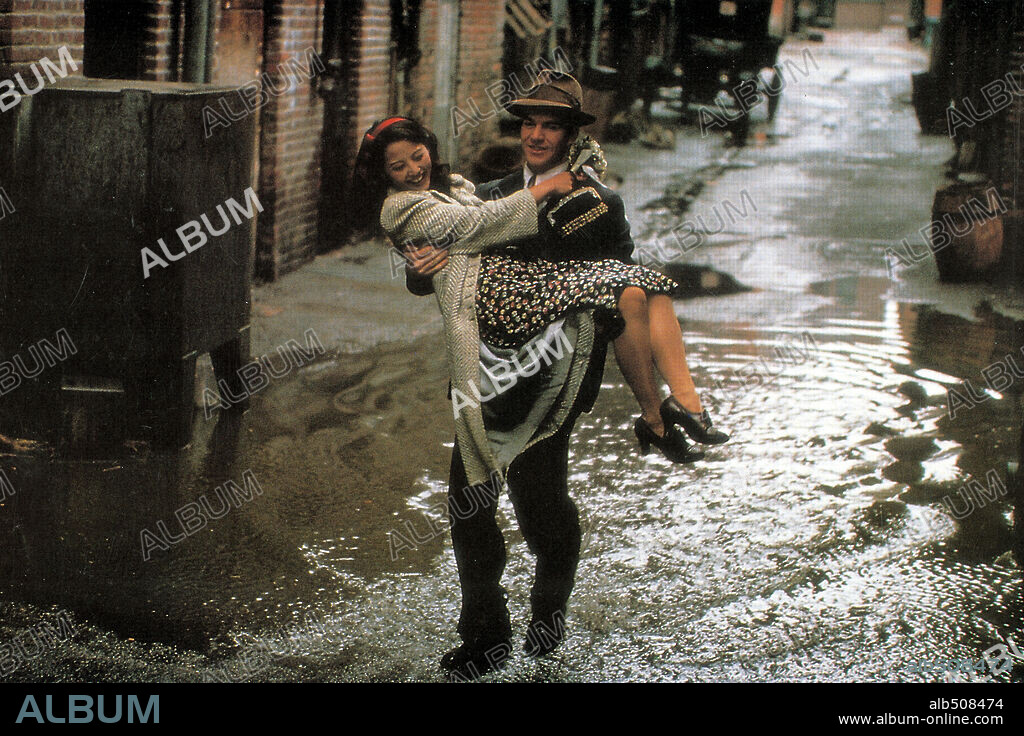 DENNIS QUAID and TAMLYN TOMITA in COME SEE THE PARADISE, 1990, directed by ALAN PARKER. Copyright 20TH CENTURY FOX.