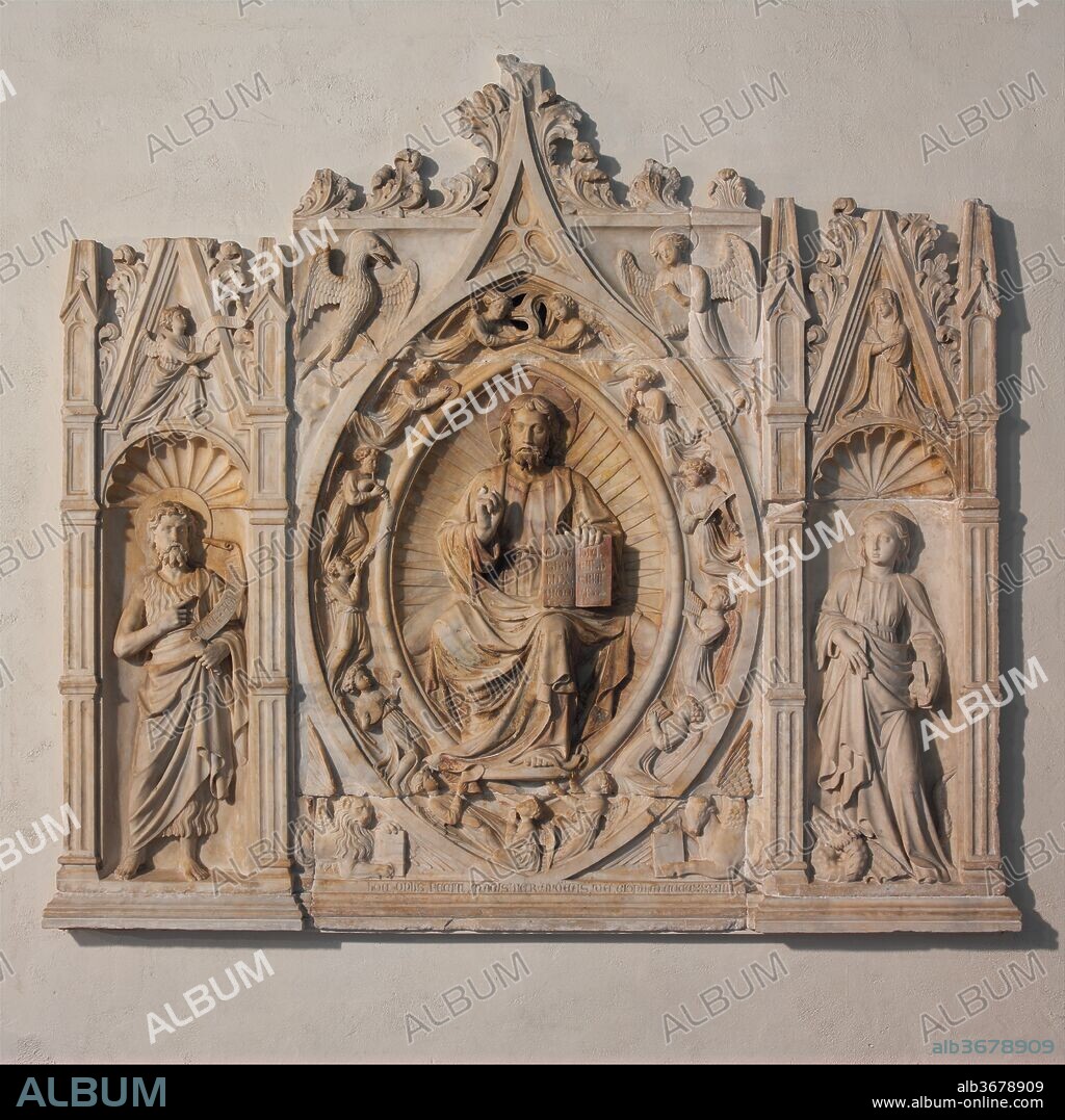Altarpiece with Christ, Saint John the Baptist, and Saint Margaret. Artist: Andrea da Giona (Italian, active ca. 1434-46). Culture: Italian. Dimensions: Overall: 72 x 80 x 5 in., 1614lb. (182.9 x 203.2 x 12.7 cm, 732.1kg)
a: central panel: 505lb. (229066.5g)
b: Top center: 210lb. (95255.4g)
c: Saint John (L): 329lb. (149233.4g)
d: Saint Margaret (R): 194lb. (87997.8g)
e: Kneeling Angel: 121lb. (54885.2g)
f: Bottom Central Panel: 181lb. (82101.1g)
g: Plinth (L): 28lb. (12700.7g)
h: Modern Plinth (R): 28lb. (12700.7g)
i: Angel Wing (Modern): 18lb. (8164.7g). Date: 1434.
At the center of this finely carved relief, heavenly angels with musical instruments surround the figure of Christ in Majesty. At the corners are symbols of the four Evangelists, authors of the Gospels. Saints John the Baptist and Margaret, associated with the commissioners of the altarpiece, appear at either side. Above them, in smaller scale, an earlier chapter in the Christian story is evoked by the scene of the angel Gabriel addressing the Virgin Mary with the news that she will be the mother of Jesus. At the time the Knights of Rhodes commissioned this altarpiece, they were notorious heavily armed sailors, pursuing Muslim merchant ships across the Mediterranean, often pillaging their cities and gaining great wealth in the process. The altarpiece is inscribed along the lower edge of the central panel: HOC OPUS FECIT MAGISTER AND[R]EAS DA GIONA MCCCCXXXIIII (This work was made by Master Andrea from Giona 1434).