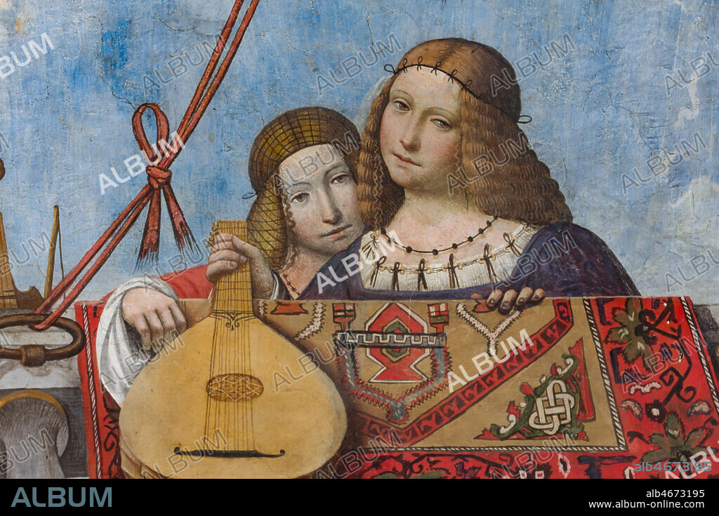 Ferrara, Palazzo Costabili or Palazzo di Ludovico il Moro (today it is the seat of the National Archaeological of Spina), Aula Costabiliana o Hall of the Treasure, vault, XVI century frescoes by Benvenuto Tisi, known as il Garofalo: detail with two beautiful gentlewomen. One is holding a lute.. Along the sides of the ceiling a large balcony, where Oriental rugs are hanging out, is painted. There is a gallery of characters, many of them have musical instruments. They leanfrom the balcony and show the observers their love for arts, music and poetry. The ceiling is almost a showcase of the aristocracy of the time with portraits of rare elegance. In an evocative scenography, above the balcony, there are a turquoise sky , with a gazebo filled with branches of fruit, knotted around the balustrade. This room is, in fact, a hortus conclusus, a secret garden realised by the owner for his notable guests.. At the centre there are a magnificent rose window in carved and gilded wood, and a painted architecture that is used both as a decoration and as a cover. All around runs a frieze that goes all around the room, with grotesque medallions depicting with scenes taken from mythology and stories of ancient Rome.