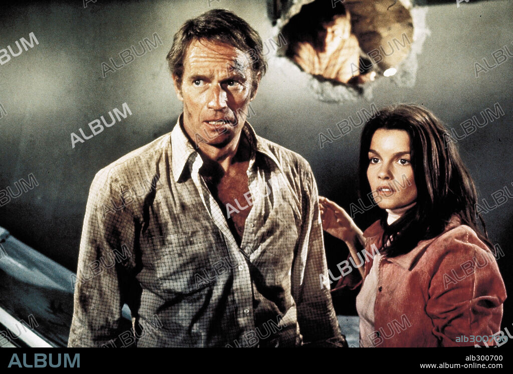 CHARLTON HESTON and GENEVIEVE BUJOLD in EARTHQUAKE, 1974, directed by MARK ROBSON. Copyright UNIVERSAL PICTURES.