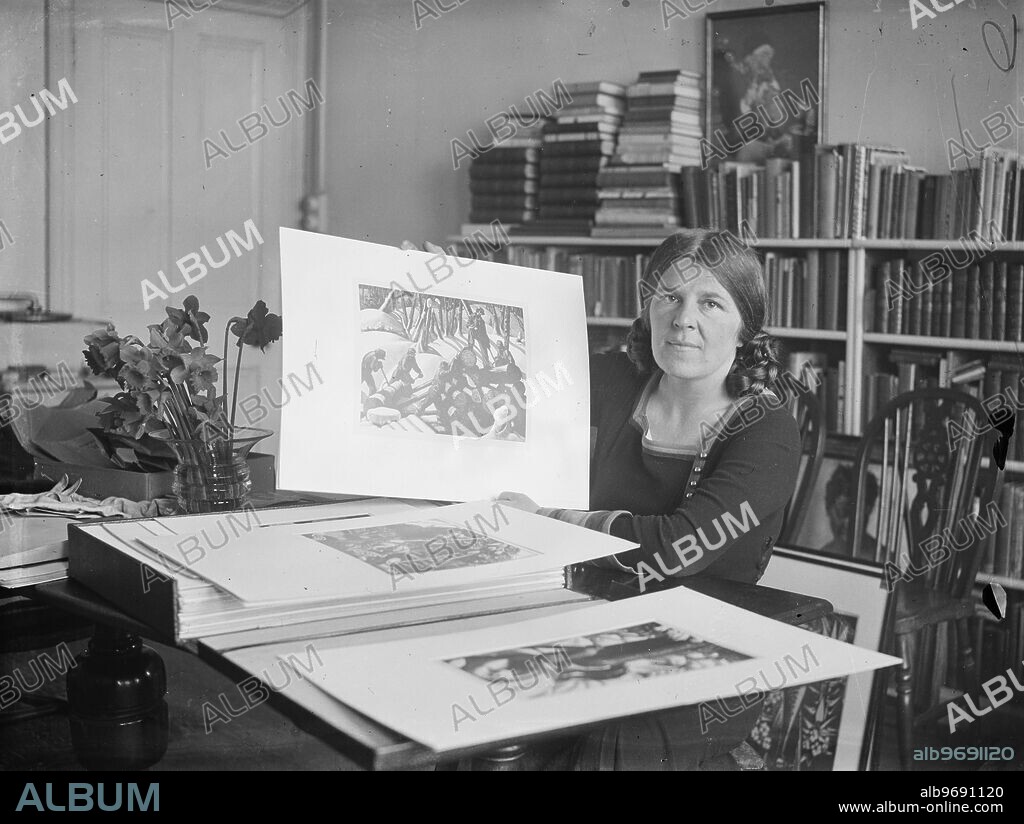 Woman artist honoured . Three women , Clare Leighton , Vanessa Bell and Winifred Nicholson, are included in the list of 24 contemporary British artists whose wrok will represent this country at the nineteenth International art exhibition at Venice this summer . Photo shows , Miss Clare Leighton with some of her work which will be exhibited , photographed in her London home . These are wood engravings some of which were done in Canadian lumber camps . 28 March 1934.