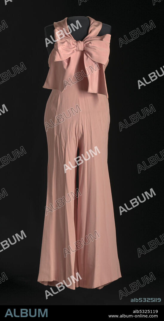 WILLIAM TRAVILLA. Jumpsuit worn by Diahann Carroll as the character Julia Baker on the television show "Julia." The jumpsuit is a halter with a large bow in the front and wide legs. African-American actress, singer, model, and activist Diahann Carroll (1935-2019) rose to prominence in some of the earliest major studio films to feature black casts, including Carmen Jones (1954) and Porgy and Bess (1959).
