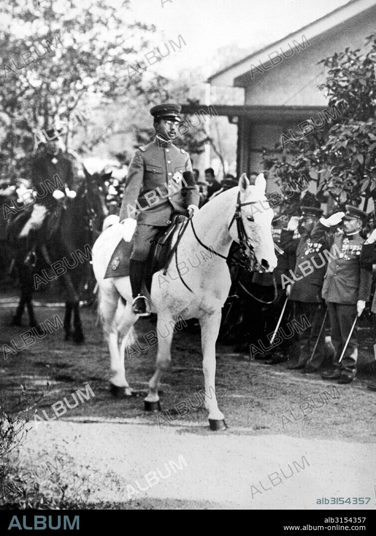 Tokyo, Japan:  1928. The Emperor of Japan, Hirohito, reviews the officers of the new training school for Japanese Boy Scouts. The school has been established by the Department of Education.