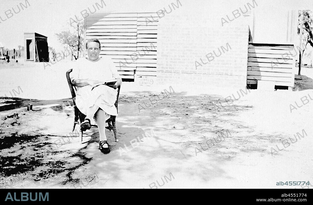 Negative - Mrs Alice Smith, First Postmistress, Hunter, Victoria, 1924, Mrs Alice Smith, Hunter's first post mistress outside her home. The home was a typical Soldier Settler's residence.