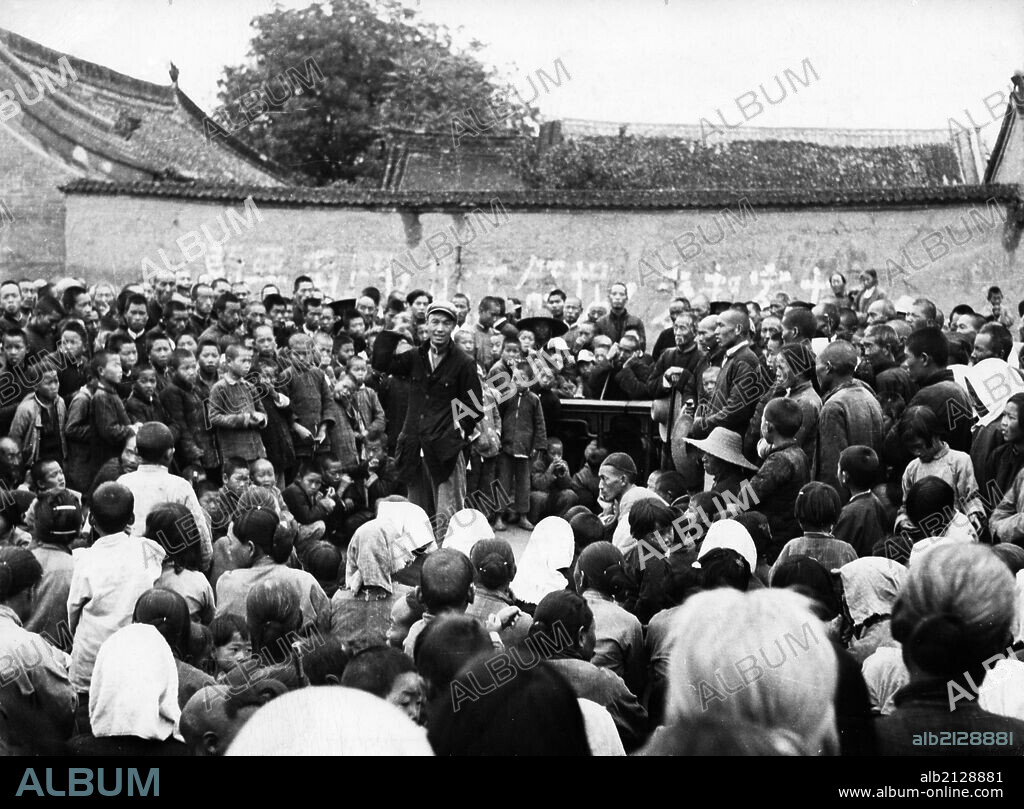 Land reform in china, one in a series of meetings held to explain the agrarian reform law in ma wa village, henan province in the early 1950s.