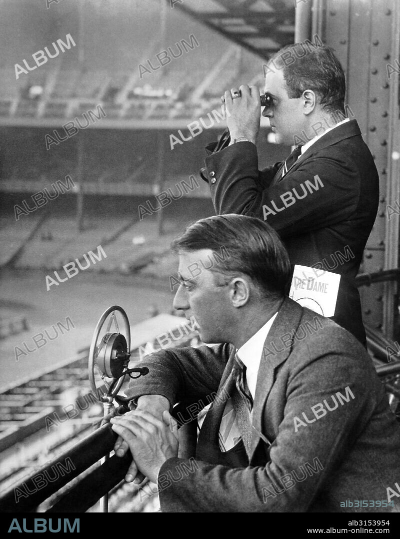 United States:   c. 1930 Radio sports announcers broadcasting a Notre Dame football game.