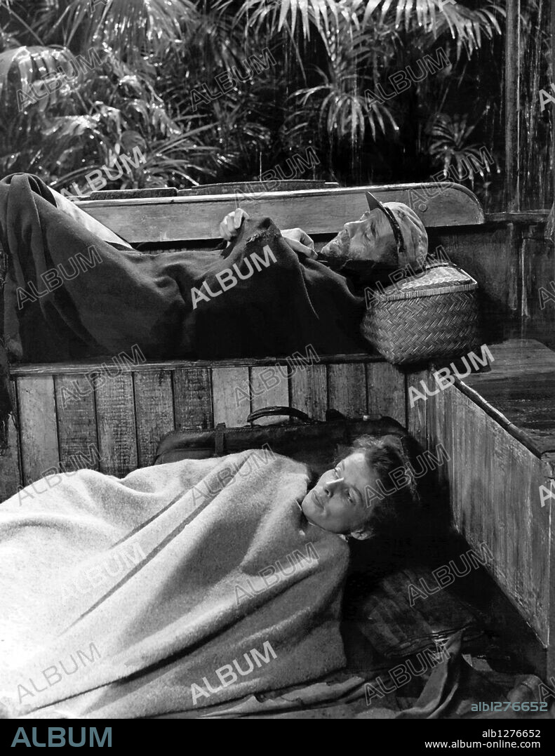 HUMPHREY BOGART und KATHARINE HEPBURN in THE AFRICAN QUEEN, 1951, unter der Regie von JOHN HUSTON. Copyright UNITED ARTISTS.