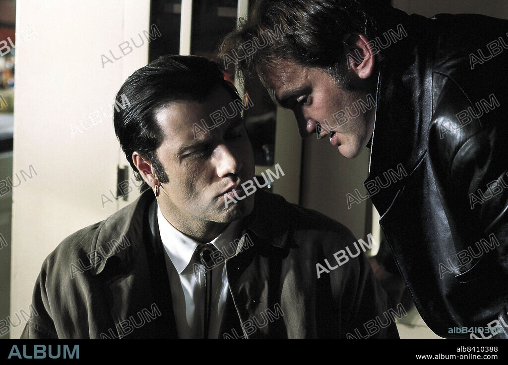 JOHN TRAVOLTA y QUENTIN TARANTINO en PULP FICTION, 1994, dirigida por QUENTIN TARANTINO. Copyright MIRAMAX.