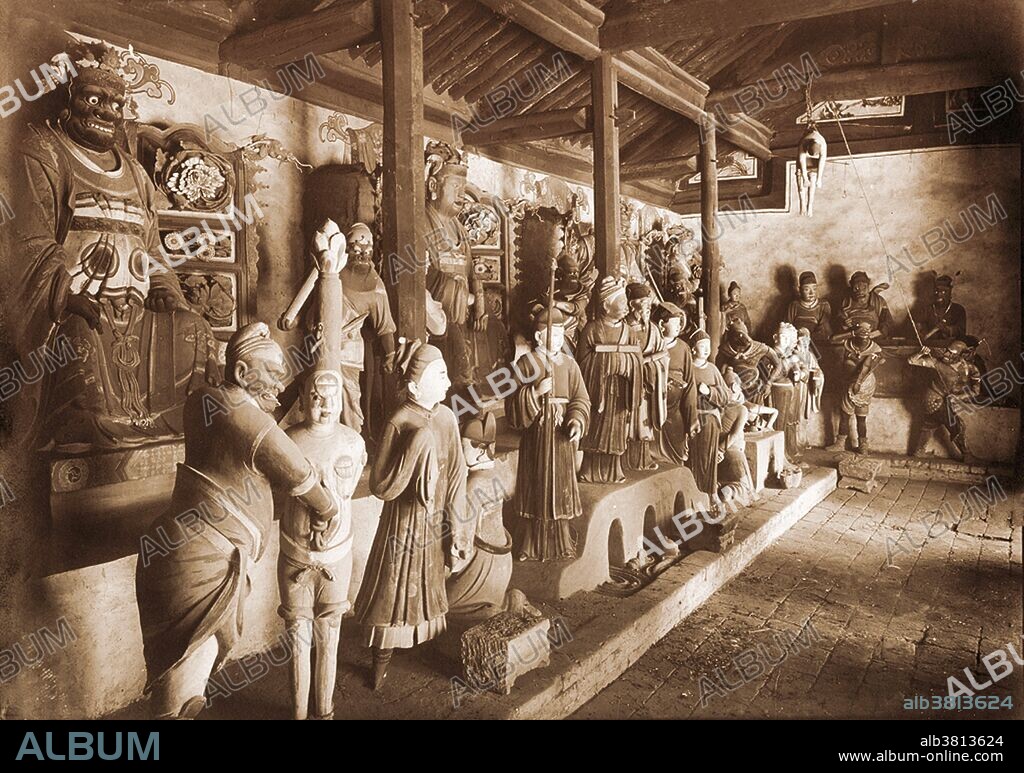 Representation of Buddhist hell (Naraka) in the Lung-wang Miao at Yan'an, Shaanxi, China. Photograph by Arthur de Carle Sowerby (1885-1954). These photographs were taken on Robert Sterling Clark's 1908-09 expedition to the Shanxi, Shaanxi, and Gansu provinces of China. Note the man hoisted to the rafters at top right, who is presumably being tormented. Naraka is a term in Buddhist cosmology, usually referred to in English as "hell" or "purgatory." The Narakas of Buddhism are closely related to diyu, the hell in Chinese mythology. A Naraka differs from the hells of Abrahamic religions in two respects: firstly, beings are not sent to Naraka as the result of a divine judgment and punishment; secondly, the length of a being's stay in a Naraka is not eternal, though it is usually very long. A being is born into a Naraka as a direct result of his or her accumulated karma and resides there for a finite period of time until that karma has achieved its full result. After his or her karma is used up, he or she will be reborn in one of the higher worlds as the result of karma that had not yet ripened.