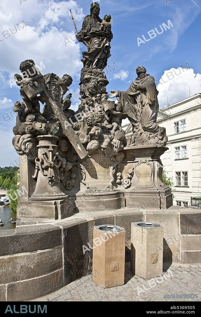 Statue of the Madonna attending to St. Bernard, Charles Bridge, Vltava river, UNESCO World Cultural Heritage, Prague, Czech Republic, Europe