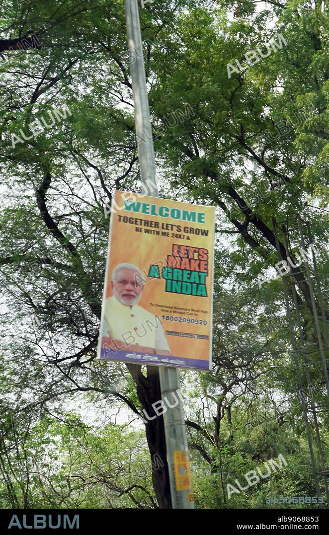 Political poster for the party of Indian Prime Minister Narendra Mohdi. Narendra Damodardas Modi (born 17 September 1950) is an Indian politician who is the 14th and current Prime Minister of India, in office since May 2014. He was the Chief Minister of Gujarat from 2001 to 2014, and is the Member of Parliament for Varanasi. Modi, a member of the Bharatiya Janata Party (BJP), is a Hindu nationalist and member of the right-wing Rashtriya Swayamsevak Sangh (RSS).