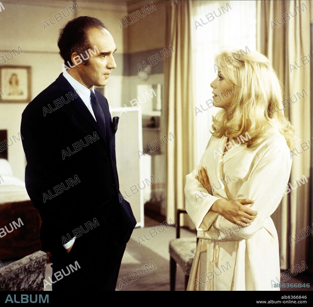 Catherine Dorléac and MICHEL PICCOLI. CATHERINE DENEUVE and MICHEL PICCOLI in BELLE DE JOUR, 1967, directed by LUIS BUÑUEL. Copyright PARIS FILM/FIVE FILM.