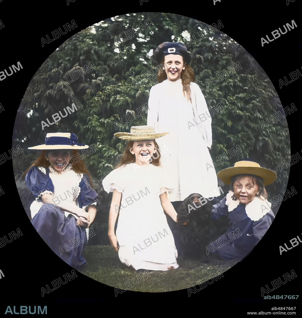 Magic Lantern slide circa 1880, Victorian/Edwardian, social history. Four children and a dog pose for a family photograph.