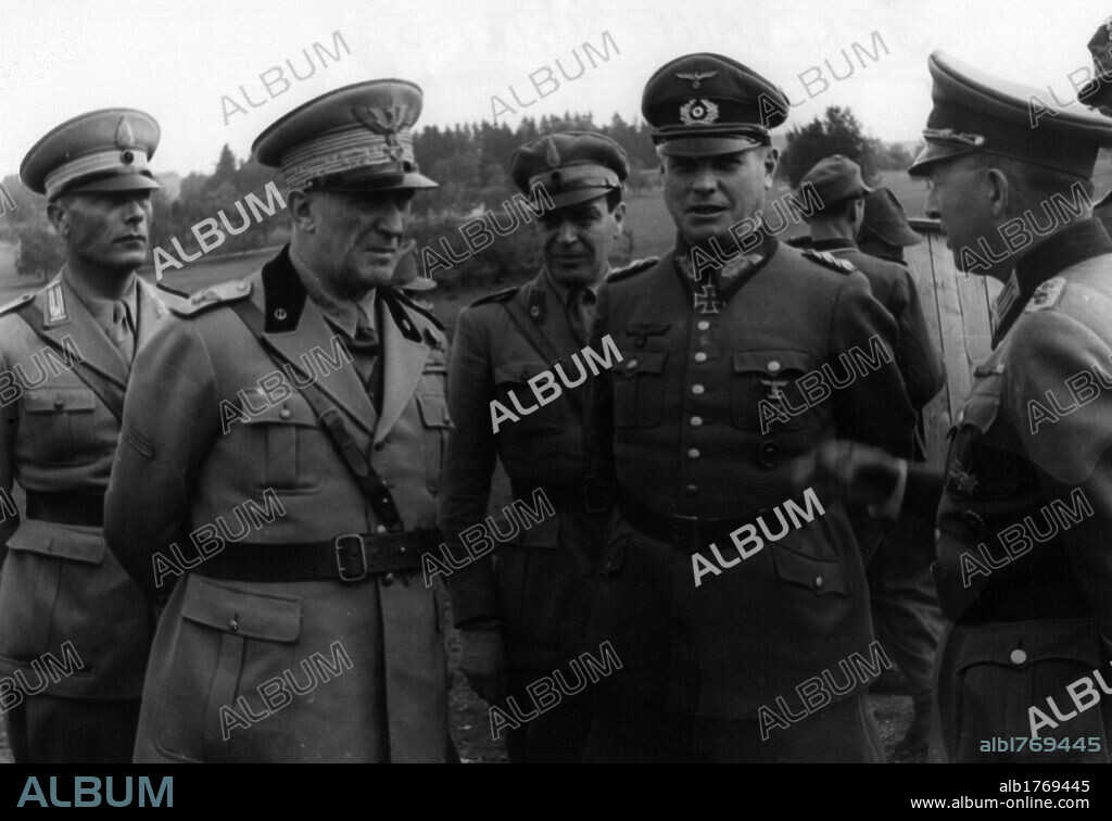 Rodolfo Graziani talks to Eugen Ott. During a firing exercise of the Monterosa Alpine Division, Marshall Rodolfo Graziani is in discussion with General Eugen Ott, the inspector of the training groups. Munzingen, 16th July 1944.