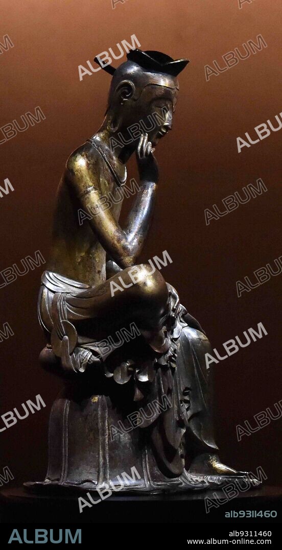 Silla Kingdom, Korea: Bodhisattva in pensive pose, probably Maitreya (Korean: Mireuk) century. Popular Bodhisattva in Silla, and it is a common pose in Buddhism at that time, sitting with the right leg crossed over the left leg and gently touching the neck with the fingers. Silla (BC 57-935 AD).