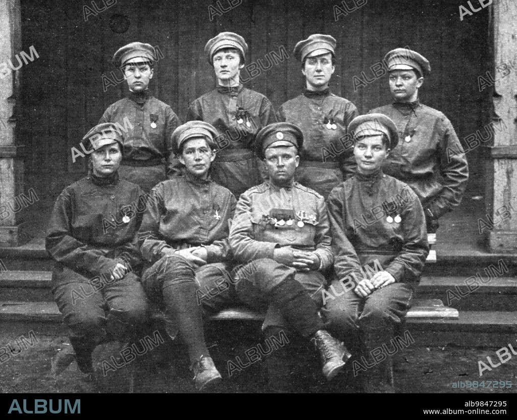 'Les Soubresauts de la Russie; L'etat-major du bataillon feminin: au centre, Mme Botchkareva, la poitrine couverte de decorations; ses adjointes, diplomees d'Ecoles superieures, ont touts eté decorees pour faits de guerre anterieurs', 1917. Upheavals in Russia: 'the staff of the women's battalion: in the centre, Mme Botchkareva, her chest covered with decorations; her assistants, graduates of higher schools, have all been decorated for previous acts of war'. (Maria Bochkareva formed the 1st Russian Women's Battalion of Death, and was the first Russian woman to command a military unit). From "L'Album de la Guerre 1914-1919, Volume 2" [L'Illustration, Paris, 1924].
