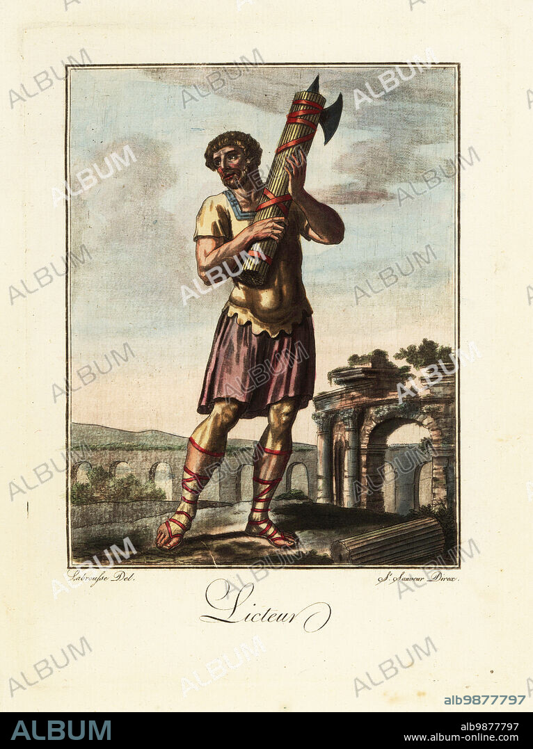 Lictor with fasces, ancient Rome. In tunic, sagulum gregale or short trounsers, sandals, in front of an acqueduct and ruined arch. Licteur. Handcoloured copperplate drawn and engraved by L. Labrousse, artist of Bordeaux, under the direction of Jacques Grasset de Saint-Sauveur from his Lantique Rome, ou description historique et pittoresque, Ancient Rome, or historical and picturesque description, Chez Deroy, Paris, 1796.