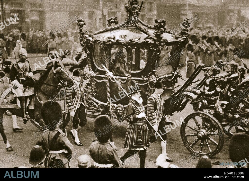King Edward VII and Queen Alexandra on their way to the State Opening of Parliament, London, 1900s. Edward VII (1841-1910) and Alexandra (1844-1925) riding in the Royal coach. Designed by Sir William Chambers and completed in 1762, it has been used at every coronation since that of George IV.