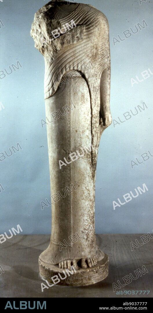 Hera of Samos (570 B.C.), Archaic Greek Art. monumental statue of a young girl wearing a chiton (a finely-pleated linen tunic), himation (woollen cloak) and veil is typical of Archaic korai. She was part of a statuary group offered by Cheramyes, an Ionian aristocrat, to the goddess Hera for her temple on Samos.