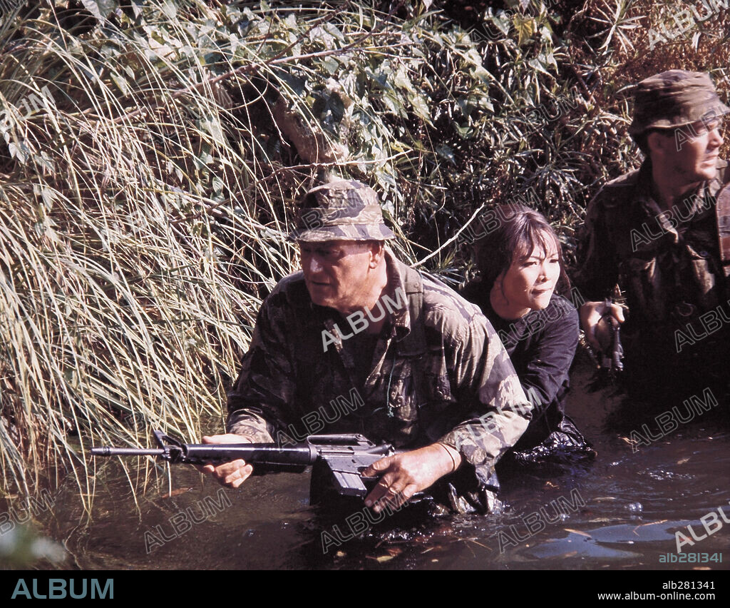 DAVID JANSSEN and IRENE TSU in THE GREEN BERETS, 1968, directed by JOHN WAYNE and RAY KELLOGG. Copyright WARNER BROS/SEVEN ARTS.