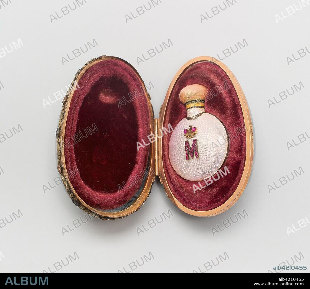 DOM FABERZHE. Miniature Easter Egg with Scent Bottle. Fabergé Workshop; Saint Petersburg, Russia, 1842-1917. Date: 1899. Dimensions: 5.1 x 8.3 x 5.6 cm (2 x 3 1/4 x 2 3/16 in.). Moss agate, gold, enamel, and cabochon rubies. Origin: Saint Petersburg.