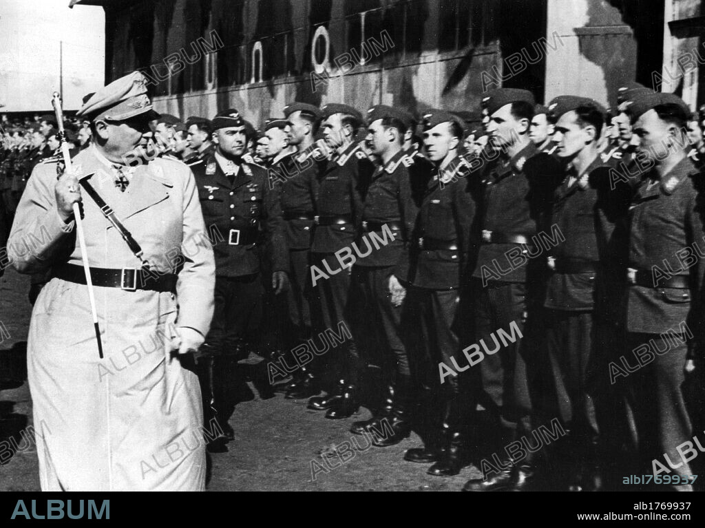 Hermann Goering inspecting a base of the German Air Force. Hermann Goering reviewing an airmen unit during an inspection of a base of the German Air Force. Italy, January 1942.