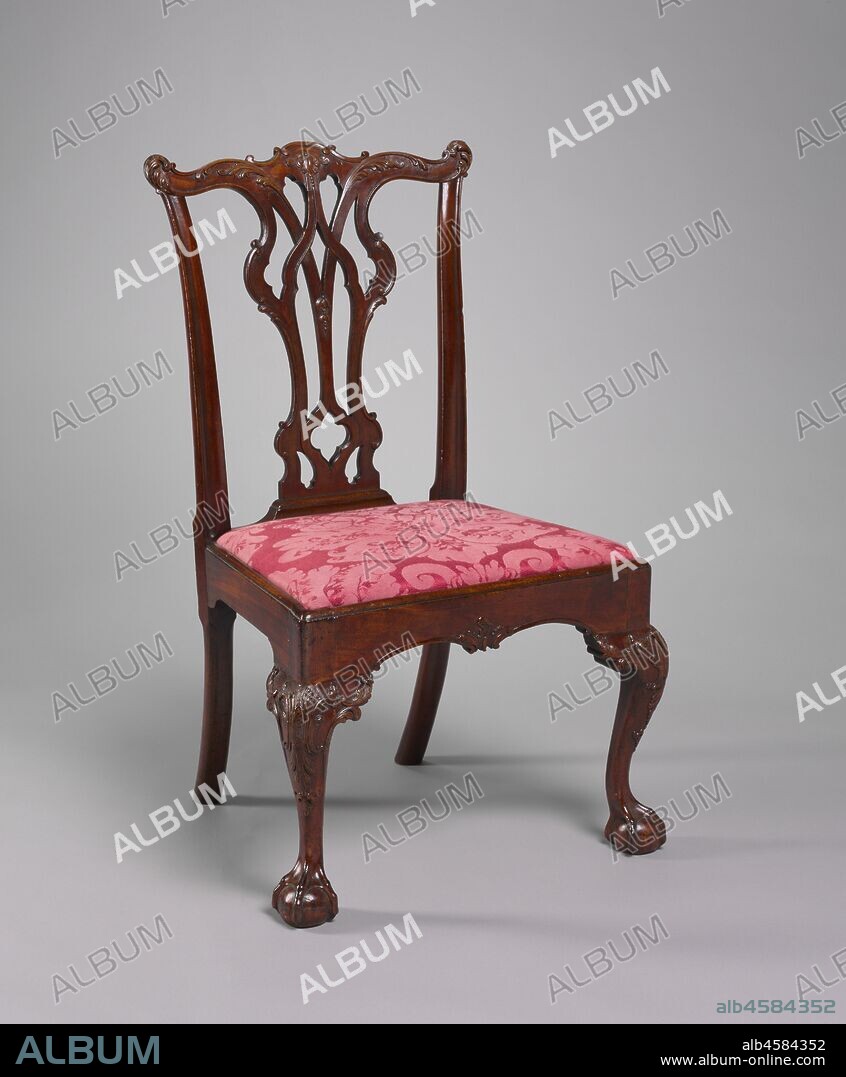 Side Chair, c. 1770. The middle section, or splat, of this chair back, with its Gothic pointed arches, may be related to the style invented by the English cabinetmaker Thomas Chippendale. English chairs of this pattern are known, so the design probably originated there and was transmitted to this side of the Atlantic, perhaps by means of an imported example. This chair comes from a set made for Thomas and Elizabeth Edwards of Philadelphia, a furniture making center famous for its carved ornament. This chair features several finely and naturalistically carved details.