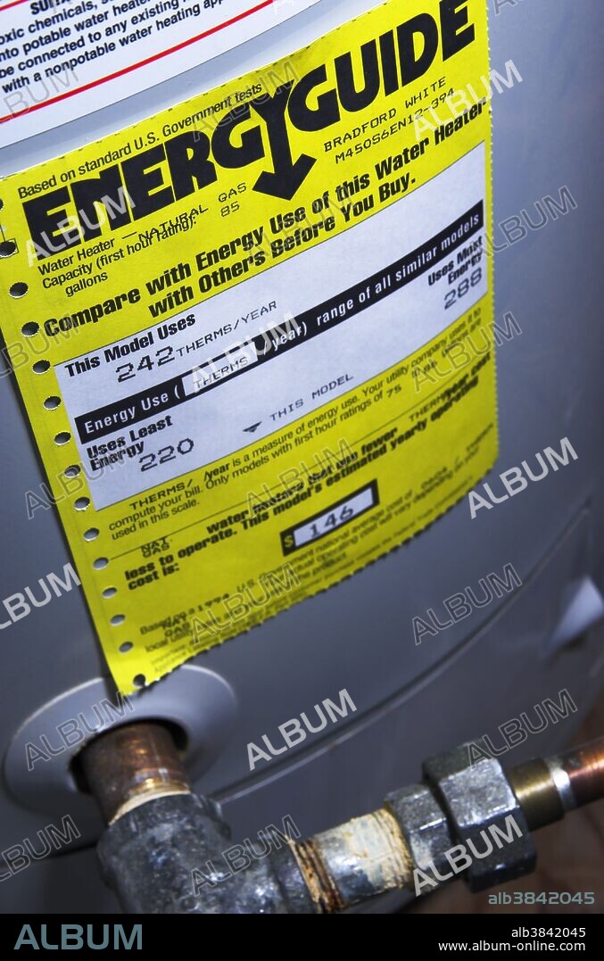 US Energy Guide label on a household water heater. The US Federal Trade Commission's Appliance Labeling Rule requires manufacturers to put yellow-and-black Energy Guide labels on most major home appliances such as refrigerators, dishwashers, clothes washers, water heaters and air conditioners. These labels contain information about the energy efficiency of a particular appliance. The efficiency ratings are based on standard test procedures developed by the US Department of Energy. Shown here is the Energy Guide label on a natural gas water heater manufactured by Bradford White. Photo Sept 2007.
