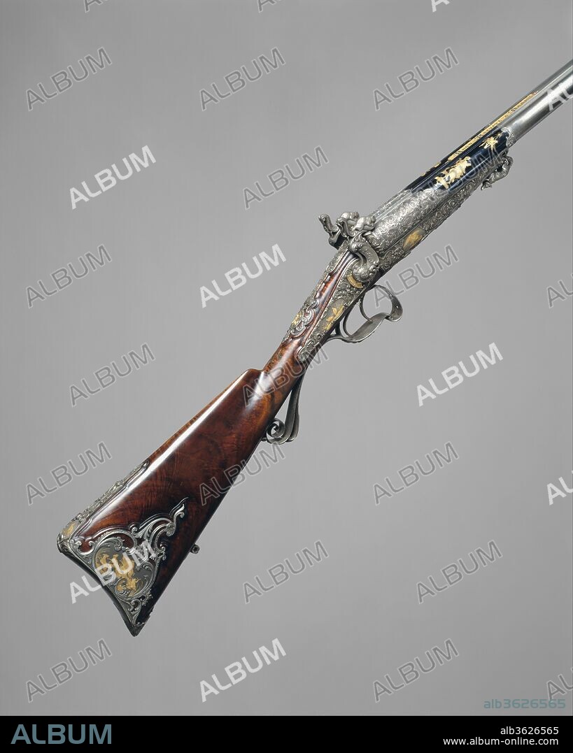 Double-Barrel Breech-Loading Pinfire Shotgun. Barrelsmith: Léopold Bernard (French, Paris, active 1832-70). Culture: French, Paris. Dimensions: L. 44 1/8 in. (112 cm). Engraver: Jean-Claude Tissot (French, Paris, 1811-1889). Goldsmith: Designed and steel chiseled by François-Auguste Fannière (French, Paris, 1818-1900); Designed and steel chiseled by François-Joseph-Louis Fannière (French, Paris, 1822-1897). Gunsmith: J. C. A. Brun (French, Paris, active 1849-72). Date: dated 1866.
The Second Empire (1852-70) marked the twilight of French gunmaking, which had dominated the design of European firearms since the period of Louis XIV. Parisian gunmakers consistently employed the finest contemporary designers, silversmiths, sculptors, and engravers to transform functional hunting and target weapons into works of art. This exquisitely decorated shotgun reflects the period's predilection for historical revivals--in this case, the style of Louix XV. Especially noteworthy is the harmonious combination of Rococo ornamental vocabulary and blue-and-gold coloring, which together evoke eighteenth-century taste. Exhibited by Brun at the Exposition Universelle of 1867, the gun is actually a collaborative work by several of the leading artists and craftsmen of the time: the damascus twist barrels are by Léopold Bernard; the overall design and the intricately chiseled steel mounts are by the goldsmiths François-Auguste and François-Joseph-Louis Fannière; and the delicate engravings on the barrels and mounts, encrusted in two-color gold, are by the engraver Tissot.