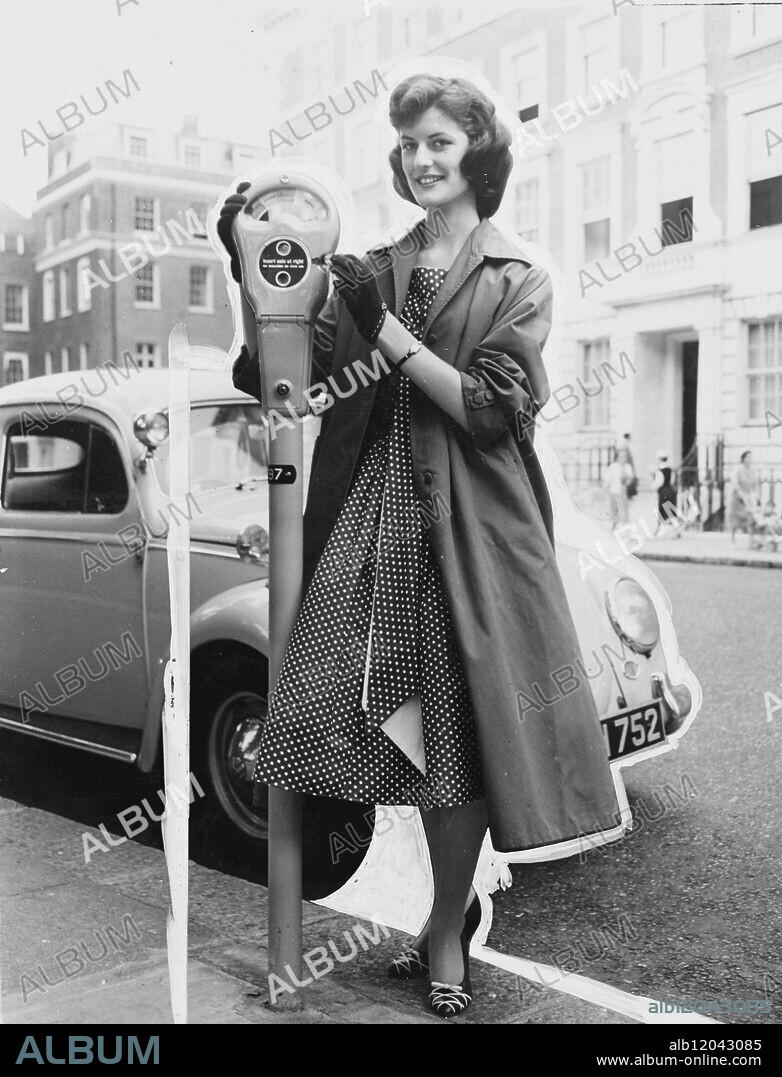 The Mayfair parking meter scheme came into operation in Mayfair. Miss Lorraine Buist, seen putting coins into the meter. 10 July 1958.