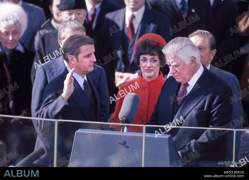 U.S. Vice President Walter Mondale with wife Joan Adams Mondale and Chief Justice Warren E. Burger, taking oath of office of Vice President of the United States from, East Portico of U.S. Capitol, Washington, D.C., USA, Bernard Gotfryd, January 20, 1977.