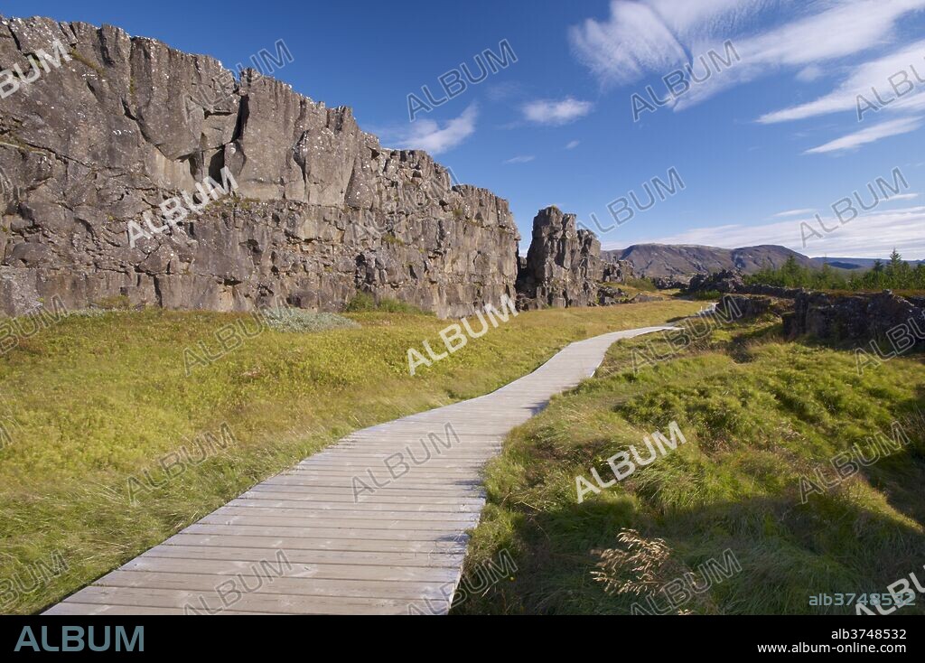 The Almannagja (All Man's Gorge) cliff face is the backdrop of the Althing, legislative assembly of the past, also the edge of the north American tectonic plate, Thingvellir National Park, UNESCO World Heritage Site, south-west Iceland (Sudurland), Iceland, Polar Regions.