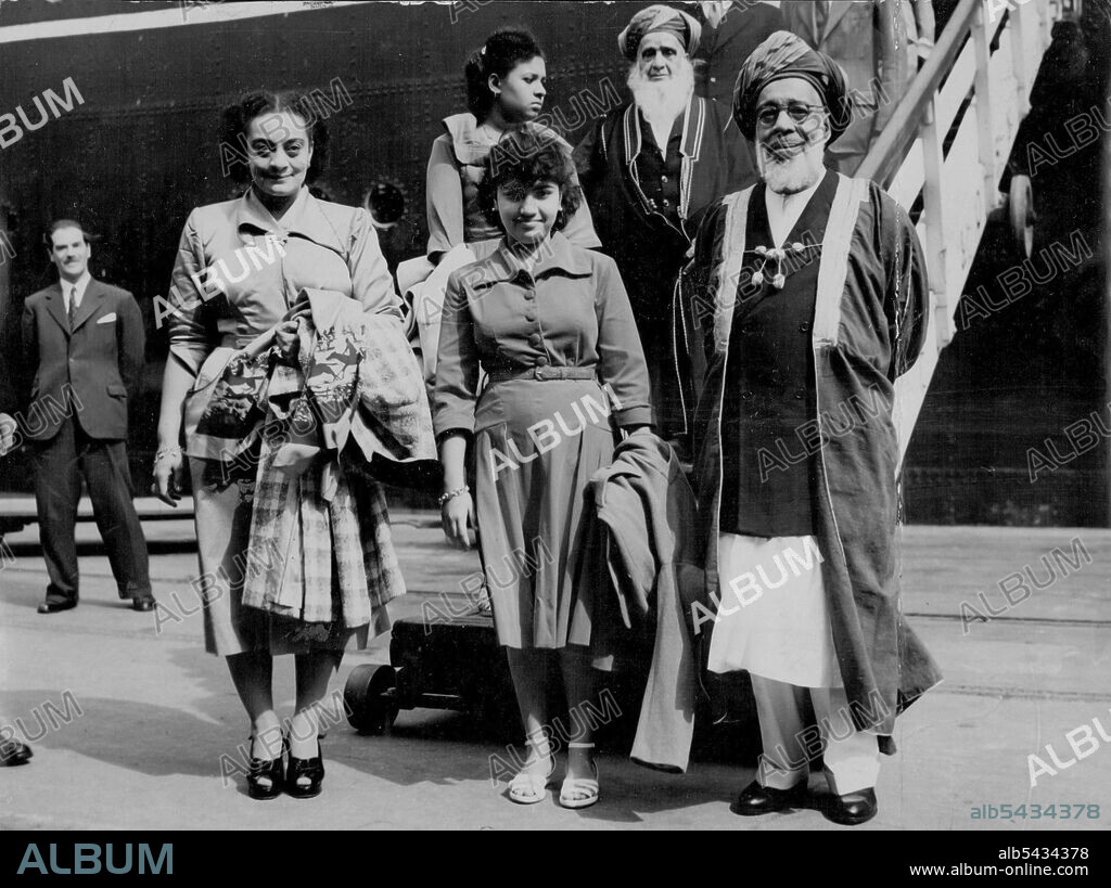 Here For The Coronation -- H.H. The Sultan of Zanzibar, Sir Seyyid Khalifa Bin Herub, with the Sultan and their daughter, Princess Amal, photographed when they arrived in the S.S. Kenya at Royal Albert docks this morning. May 23, 1953.