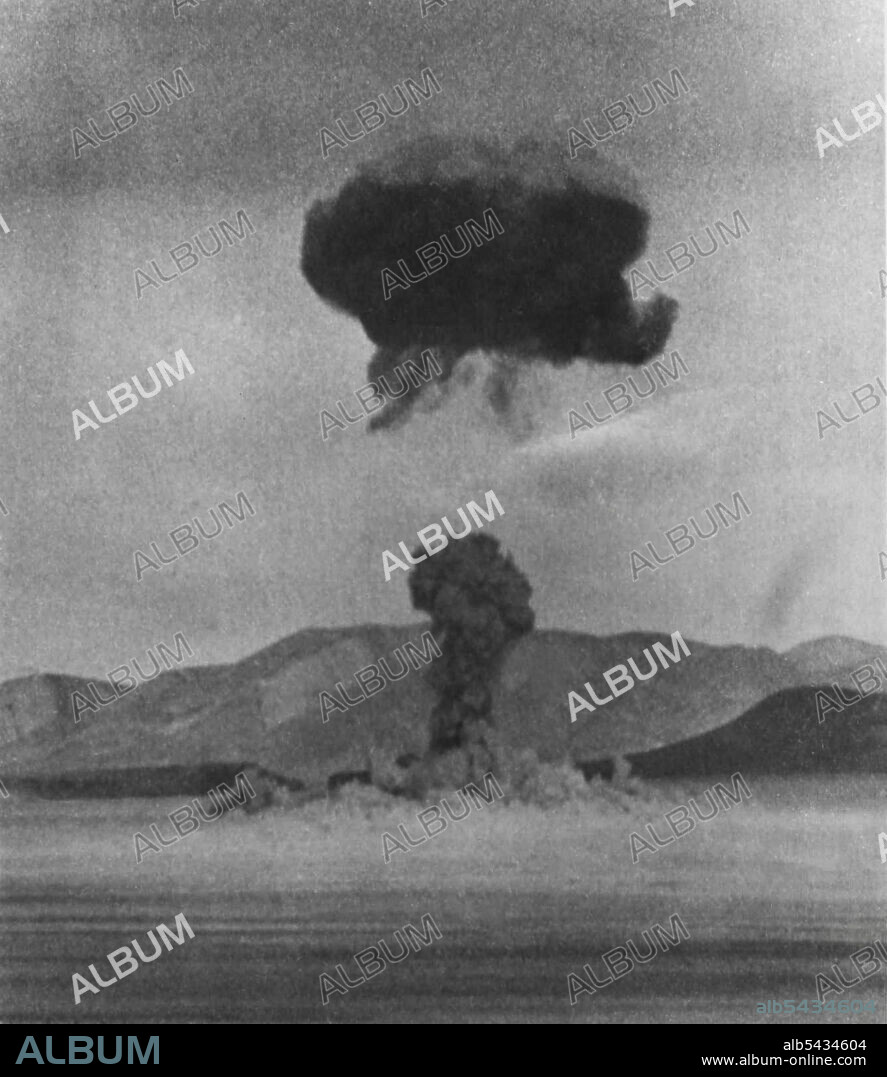 "Operation Teapot" -- The first shot of "Operation Teapot", the Spring 1955 Series of nuclear tests at Nevada Test Site, looked like this shortly after detonation at noon today. The nuclear cloud is forming from the fireball while the stem is sucked up toward the cloud. February 18, 1955. (Photo by AP Wirephoto).