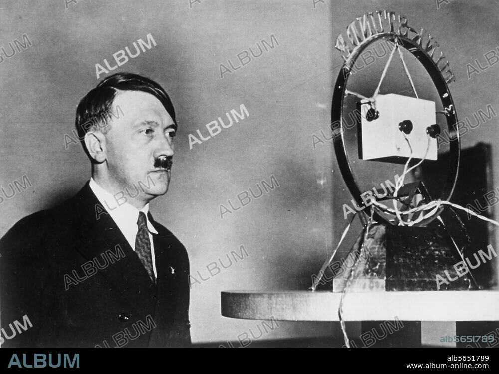 Hitler, Adolf; Dictator (NSDAP). 1889-1945. Berlin, 1 February 1933, 10pm: first radio address of the Reich's Chancellor Adolf Hitler (Hitler reads out an appeal to the German people "Aufruf an das deutsche Volk" which was decided on by the cabinet: Hitler at the microphone.