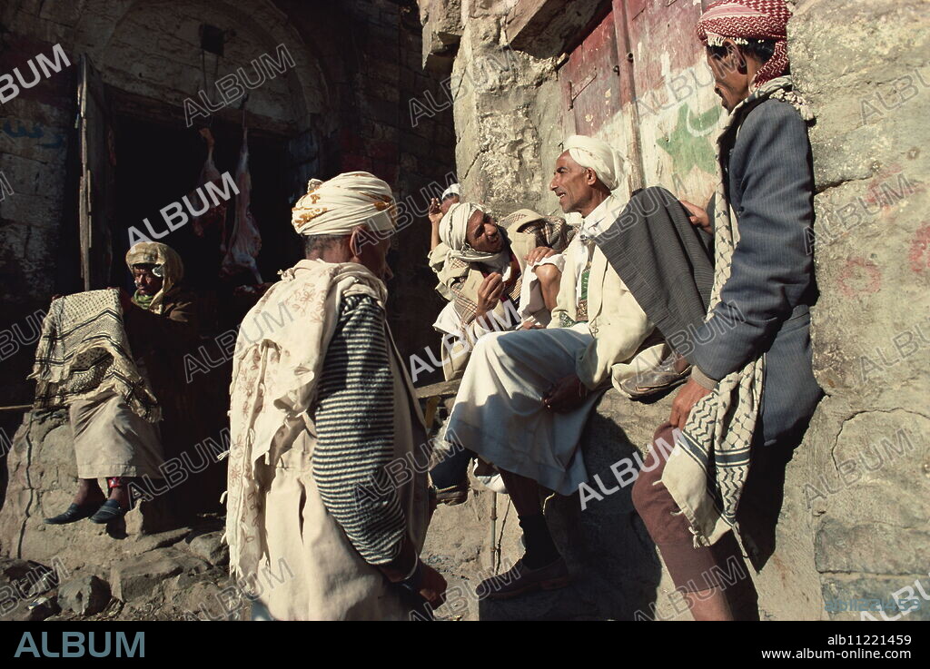 Men gossiping in the souk, Jibla, Yemen, Middle East.