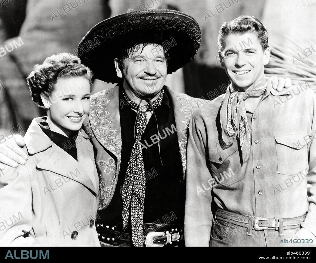 LARAINE DAY, RONALD REAGAN and WALLACE BEERY in THE BAD MAN, 1941, directed by RICHARD THORPE. Copyright M.G.M.