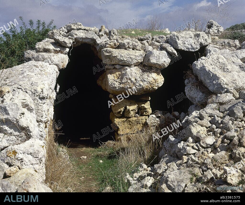 Spain, Balearic Islands, Menorca, Ferreries. Naviform settlement of Son Mercer de Baix. Inhabited site between the Early Bronze Age (1400 BC) and the Talayotic period (1000 BC). Naviform village with boat-shaped houses, called "naveta". Naveta of the Es Moro cave or naveta 1.