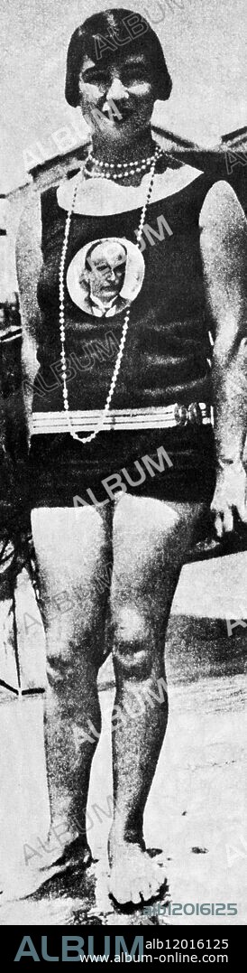 An Italian girl proudly displays a portrait of Mussolini on her bathing costume.1920's.
